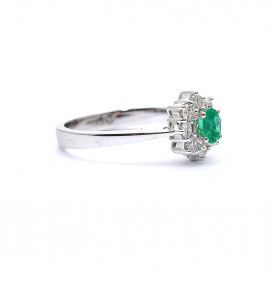White gold ring with diamond 0.27 ct and emerald 0.18 ct